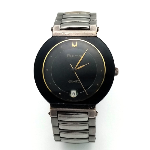 1378 - A Stylish Bulova Quartz Ladies Watch. Stainless steel bracelet and two tone case - 32mm. Black and g... 