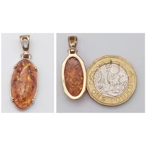 1385 - An Amber Oval Cabochon Pendant and a Pair of Amber Drop Earrings. All items set in 925 silver. Penda... 