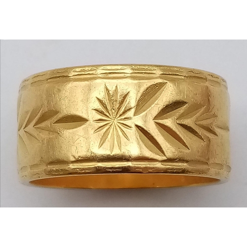 1392 - A Rich 22k Yellow Gold Band Ring with Arrowhead and Star Decoration. Size N. 10.7g weight.