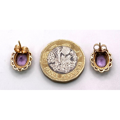 1413 - A Pair of Vintage 9K Yellow Gold Amethyst Earrings. Oval amethysts in a decorative setting. 2.4g tot... 