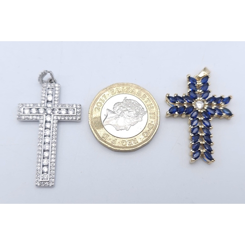 1525 - Two Bright Stone Zirconia Cross Pendants - Blue and White Stones. Largest cross - 4cm x 2cm