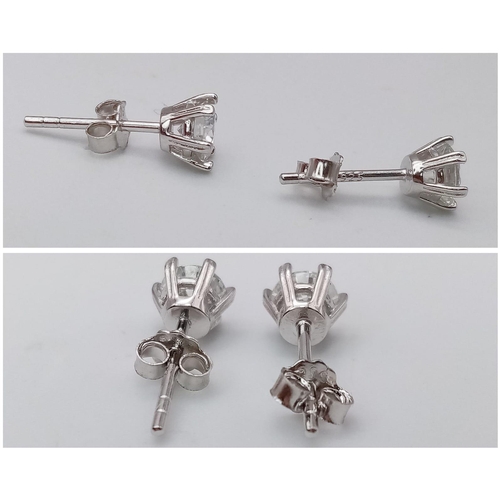 1343 - A Pair of Sterling Silver Moissanite Stud Earrings. 0.5ctw, 0.9g total weight.