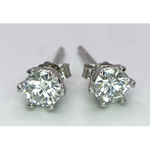 1343 - A Pair of Sterling Silver Moissanite Stud Earrings. 0.5ctw, 0.9g total weight.