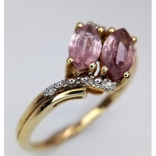 1574 - A 10k Yellow Gold, Amethyst and Diamond Crossover Ring. Size N. 2.17g total weight.