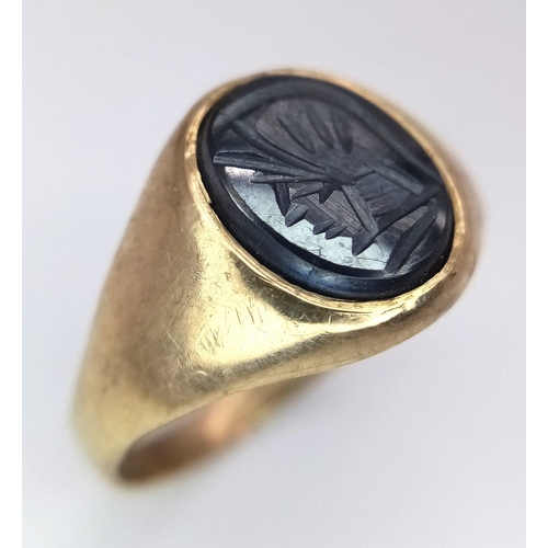 1139 - A Vintage 9K Yellow Gold Carved Grey Onyx Signet Ring. Size O. 2.55g total weight.