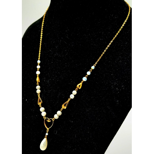 1630 - A Vintage Possibly Antique 9K Yellow Gold and Pearl Lavaliere Necklace. 4.7g total weight.