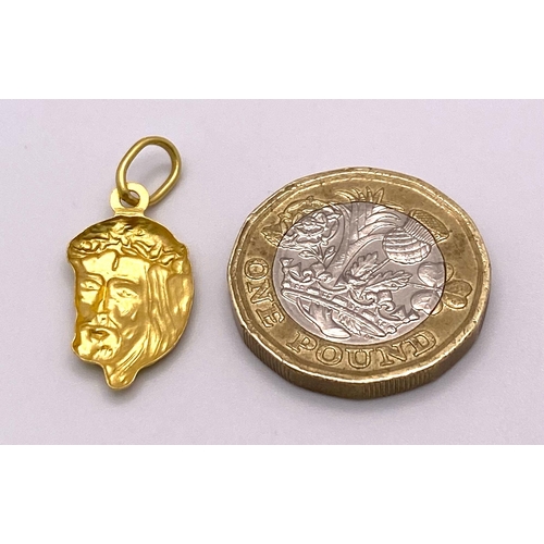 1644 - An 18K Yellow Gold Jesus Pendant. 25mm. 1g.