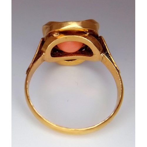 1651 - A Vintage 9K Yellow Gold (tested) Orbital Pink Coral Ring. Size Q/R. 4.6g total weight.