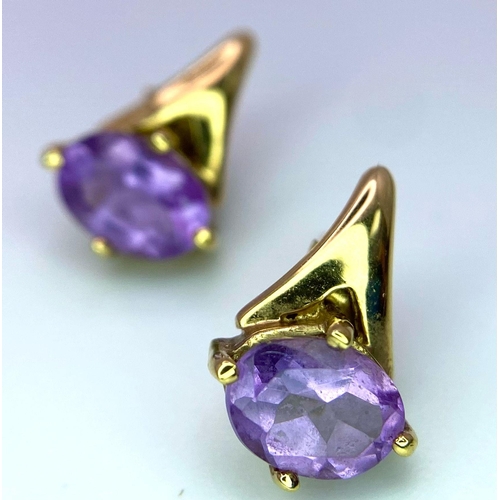 1700 - A Pair of Amethyst 9K Yellow Gold Stud Earrings. 1.73g total weight.