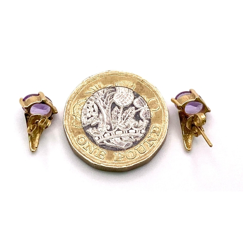 1700 - A Pair of Amethyst 9K Yellow Gold Stud Earrings. 1.73g total weight.