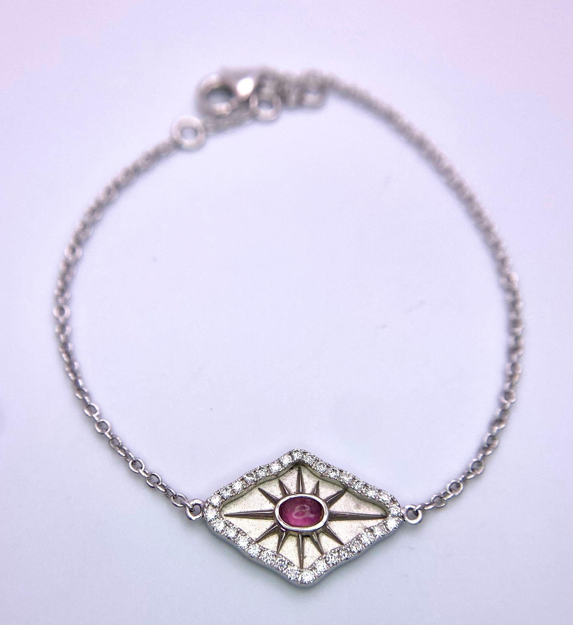 An 18K White Gold, Ruby and Diamond 'All Seeing Eye' Bracelet. 16cm. 2 ...