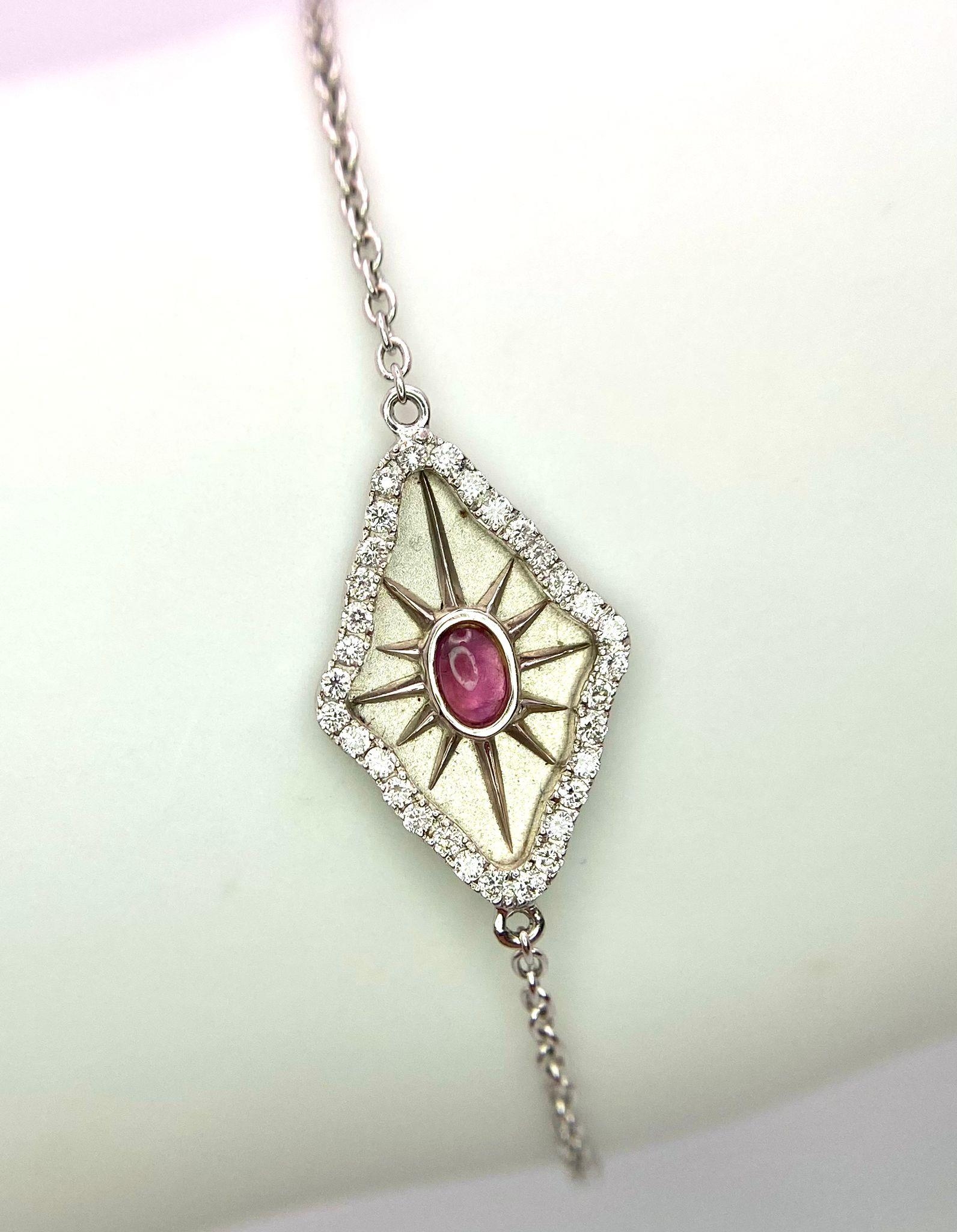 An 18K White Gold, Ruby and Diamond 'All Seeing Eye' Bracelet. 16cm. 2 ...