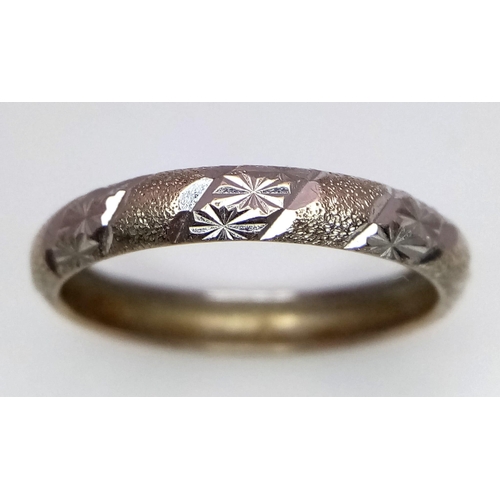 1443 - A vintage 9K white gold band ring with flower motif surrounded. Total weight 1.62G. Size T/U