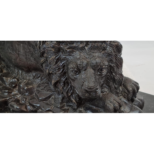 1619 - A Vintage, Possibly Antique Bronze Sculpture of a Resting Lion. Black patinated finish. Black marble... 