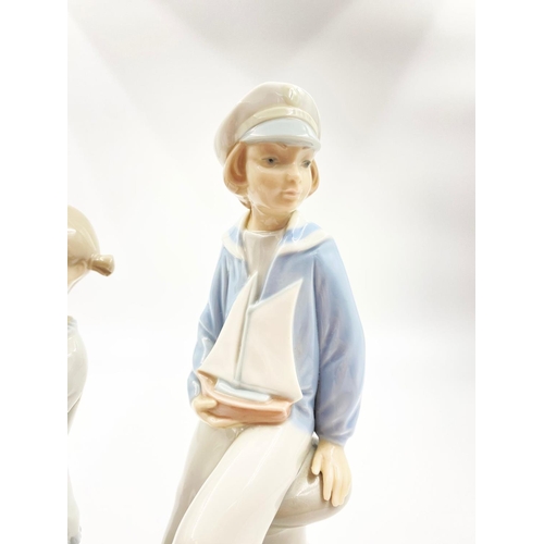 1661 - A Selection of Two Lladro Figurines. 22cm tallest piece.