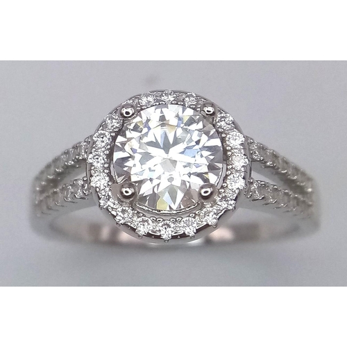 1499 - A Sterling Silver Moissanite Ring. Size P, 1ctw, 2.8g total weight.