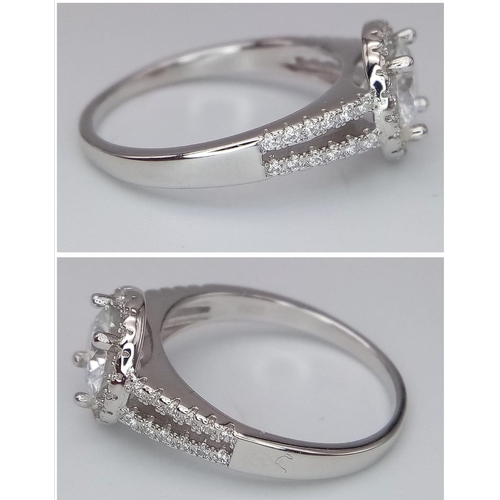 1499 - A Sterling Silver Moissanite Ring. Size P, 1ctw, 2.8g total weight.