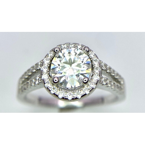 1499 - A Sterling Silver Moissanite Ring. Size P, 1ctw, 2.8g total weight.