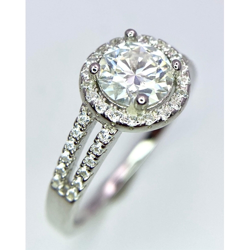 1499 - A Sterling Silver Moissanite Ring. Size P, 1ctw, 2.8g total weight.