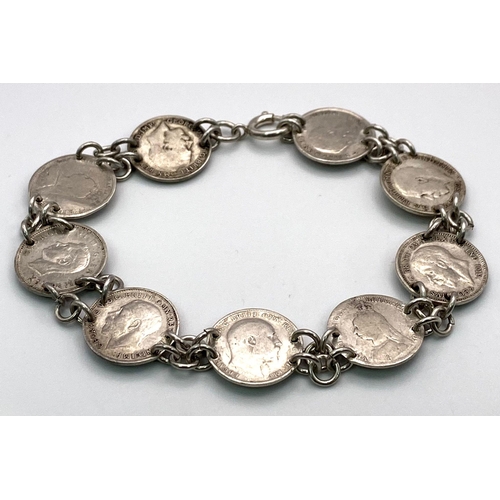 1744 - An Antique Silver Threepence Bracelet. 18.9g total weight.
18cm