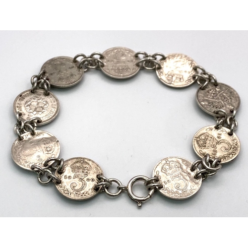 1744 - An Antique Silver Threepence Bracelet. 18.9g total weight.
18cm