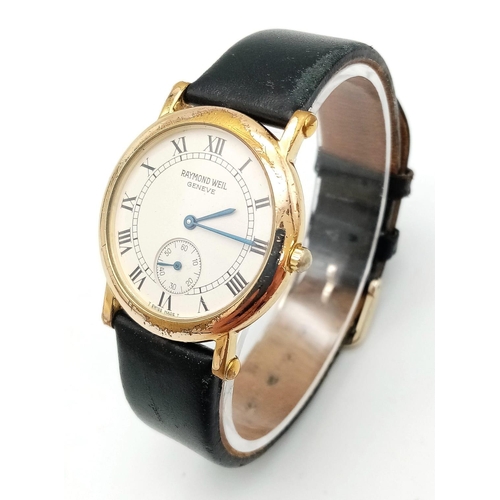 1527 - A Classic Raymond Weil Gents Dress Watch. Black leather strap. Gold plated case - 33mm. White dial w... 