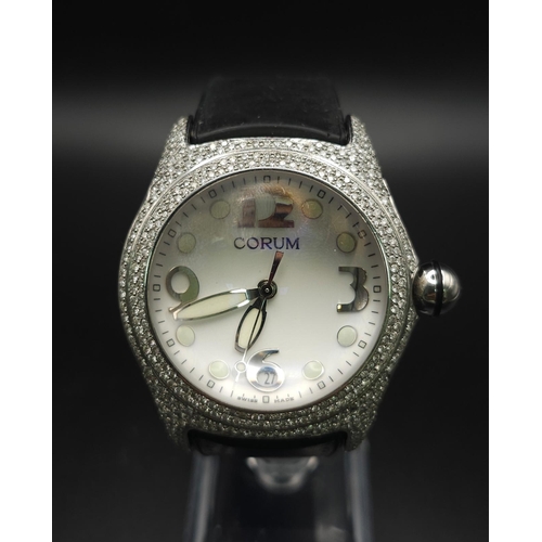 1660 - A Corum Boutique Diamond Ladies Watch. Black leather strap. Stainless steel diamond encrusted case. ... 