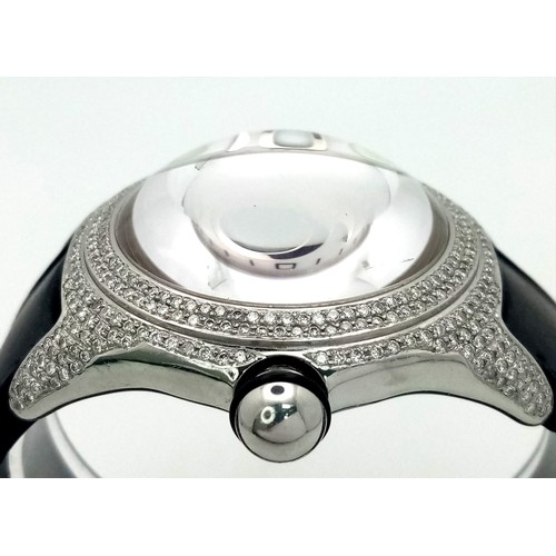 1660 - A Corum Boutique Diamond Ladies Watch. Black leather strap. Stainless steel diamond encrusted case. ... 