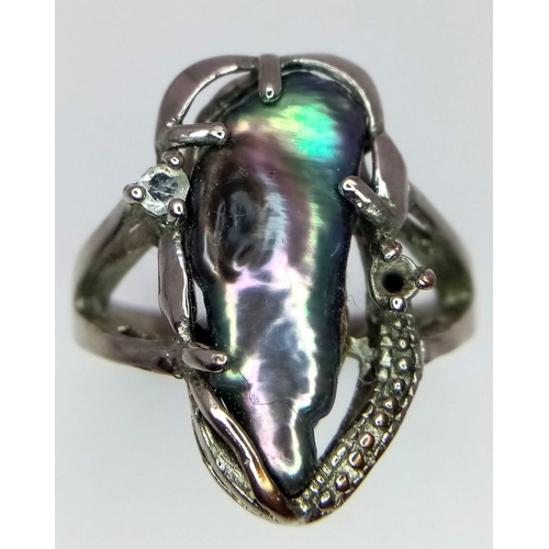 1702 - A fancy silver tested handmade solitare ring with massive Abalone centre and a small CZ decoration. ... 