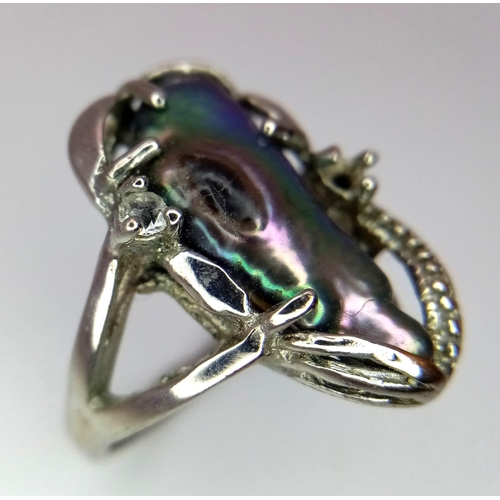 1702 - A fancy silver tested handmade solitare ring with massive Abalone centre and a small CZ decoration. ... 