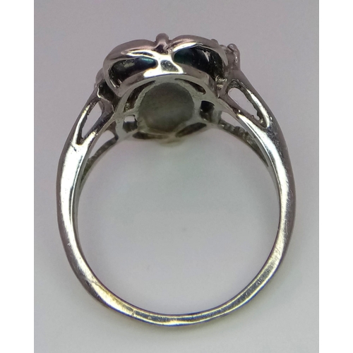 1702 - A fancy silver tested handmade solitare ring with massive Abalone centre and a small CZ decoration. ... 