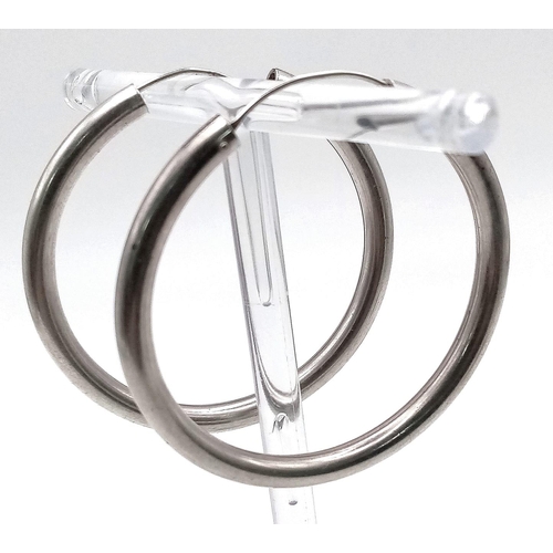 1997 - A large pair of sterling silver hoop earrings, diameter: 43 mm, weight: 11.8 g.