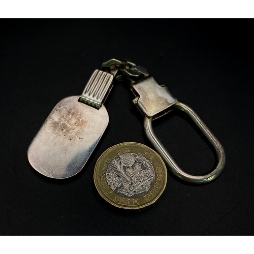 1717 - A Vintage Sterling Silver and 18K Gold Key Ring. Constructed from different parts of previous jewell... 