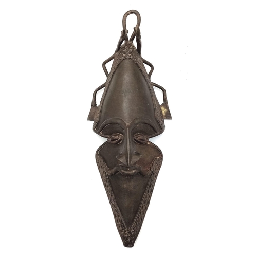 1753 - An Unusual Antique Bronze Tribal Oval Shaped African Mask. 
Serpent decoration at crown. 32cm x 14cm... 