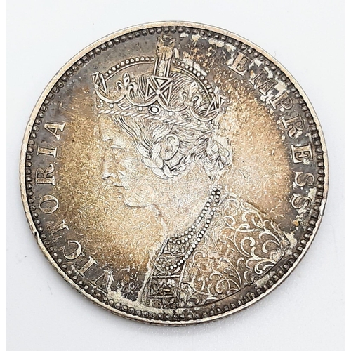 1030 - An 1891 Queen Victoria One Rupee Silver Coin.