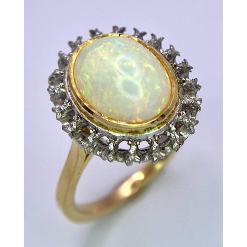 107 - A Vintage 18K Yellow and White Gold, Opal Ring. Central opal cabochon with excellent colour-play. Si... 