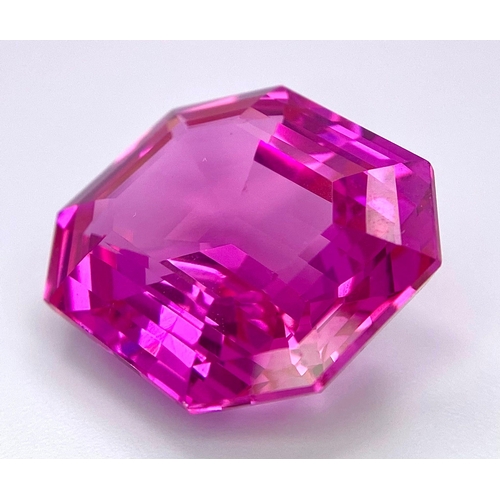 112 - An amazing, large (41,1 carats), emerald cut, pink RUBY with very interesting optical properties due... 