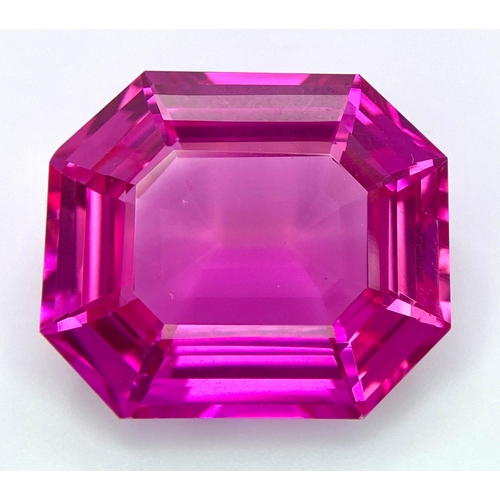 112 - An amazing, large (41,1 carats), emerald cut, pink RUBY with very interesting optical properties due... 