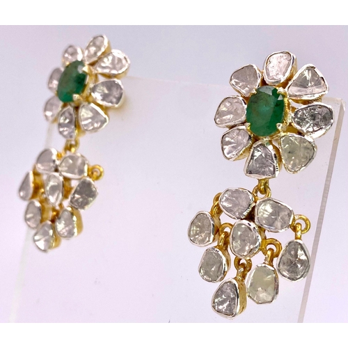 126 - An antique pair of diamond and emerald earrings with 32 large uncut natural diamonds totalling appro... 