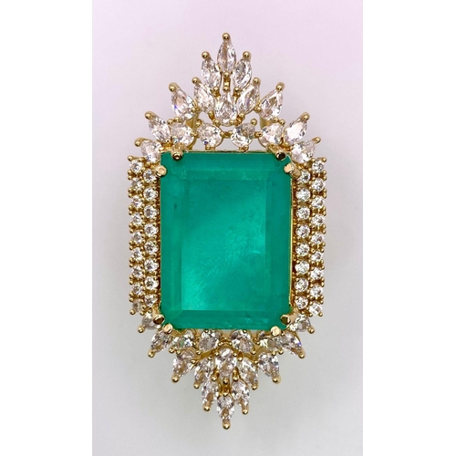 140 - A highly glamorous PRINCES JEWELLERY DESIGN cocktail ring, with a massive emerald (lab created)
surr... 