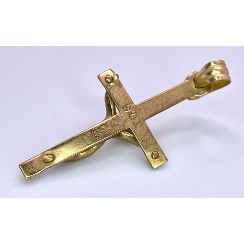 1716 - A Vintage 9K Yellow Gold Crucifix Pendant. 24 x 10mm. 0.45g weight.