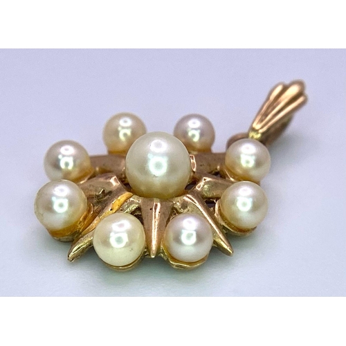 1748 - A Vintage 9K Yellow Gold Pearl Circle Pendant. 22mm. 1.9g total weight.