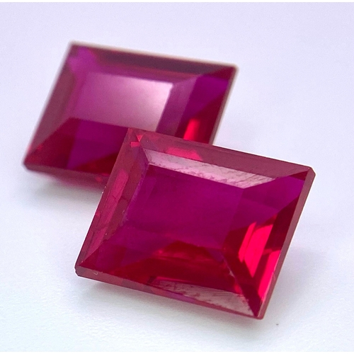 231 - A quality pair of pigeon blood red RUBIES. Emerald cut, immaculate and flawless, each stone is 9 car... 