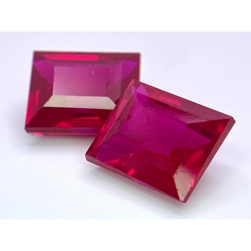 231 - A quality pair of pigeon blood red RUBIES. Emerald cut, immaculate and flawless, each stone is 9 car... 