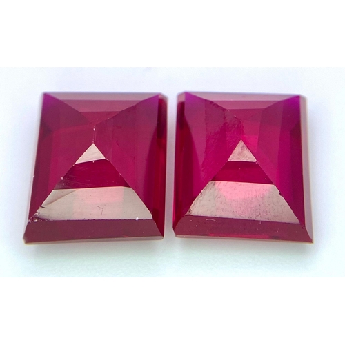 231 - A quality pair of pigeon blood red RUBIES. Emerald cut, immaculate and flawless, each stone is 9 car... 