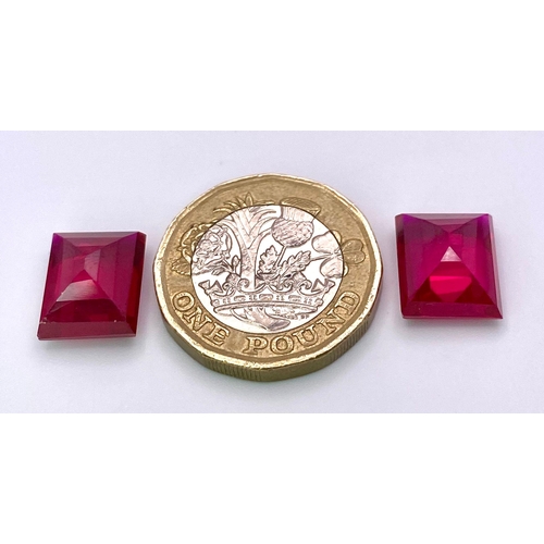 231 - A quality pair of pigeon blood red RUBIES. Emerald cut, immaculate and flawless, each stone is 9 car... 