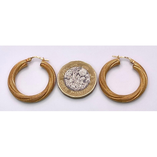 703 - A Pair of Rich and Twisted 9K Yellow Gold Hoop Earrings. 2.85g total weight.