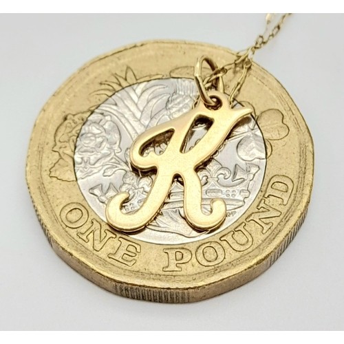 1696 - A 9K Gold K Pendant on a 9K Gold Disappearing Necklace. 15mm and 46cm. 0.8g