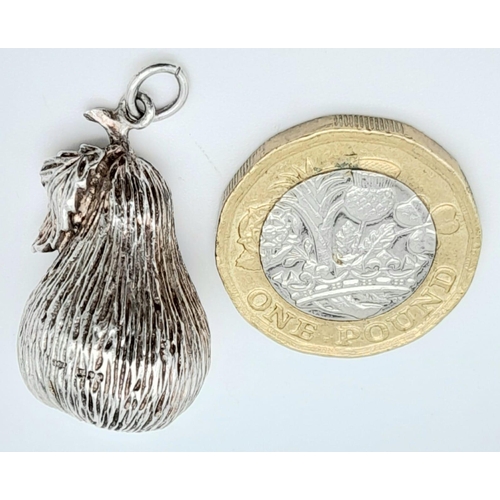 1652 - Parcel of Sterling Silver Jewellery.
A pear charm/pendant, a clasp bracelet (18cm) and a wavy ring (... 