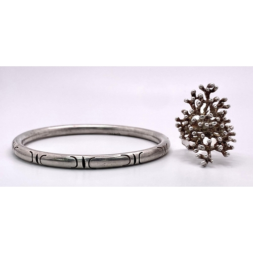 1999 - A parcel of stylish Silver Jewellery.
1) Large 'Branching' Ring (Size: R)
2) Mexican Bangle (7cm dia... 